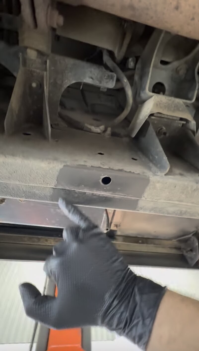 Test patch – chassis leg – Checking a chassis outrigger and crossmember up close – confirming sound, treatable metal before committing to the full programme.