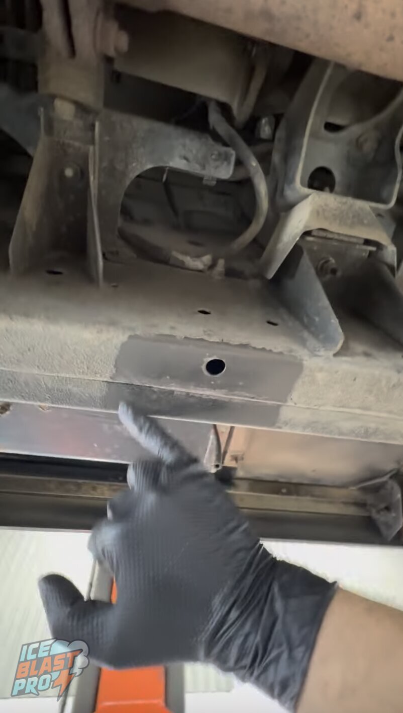 Test patch – chassis leg – Checking a chassis outrigger and crossmember up close – confirming sound, treatable metal before committing to the full programme.