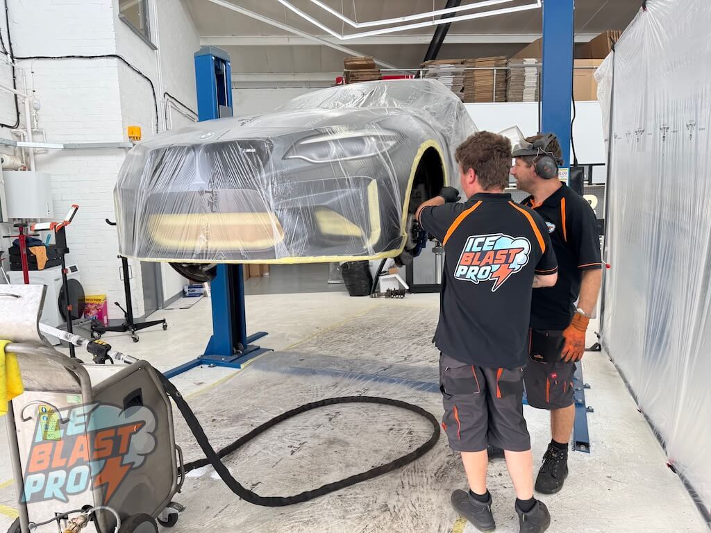 The IceBlastPro team carrying out underbody dry ice blasting at the specialist Oxfordshire workshop used by London customers