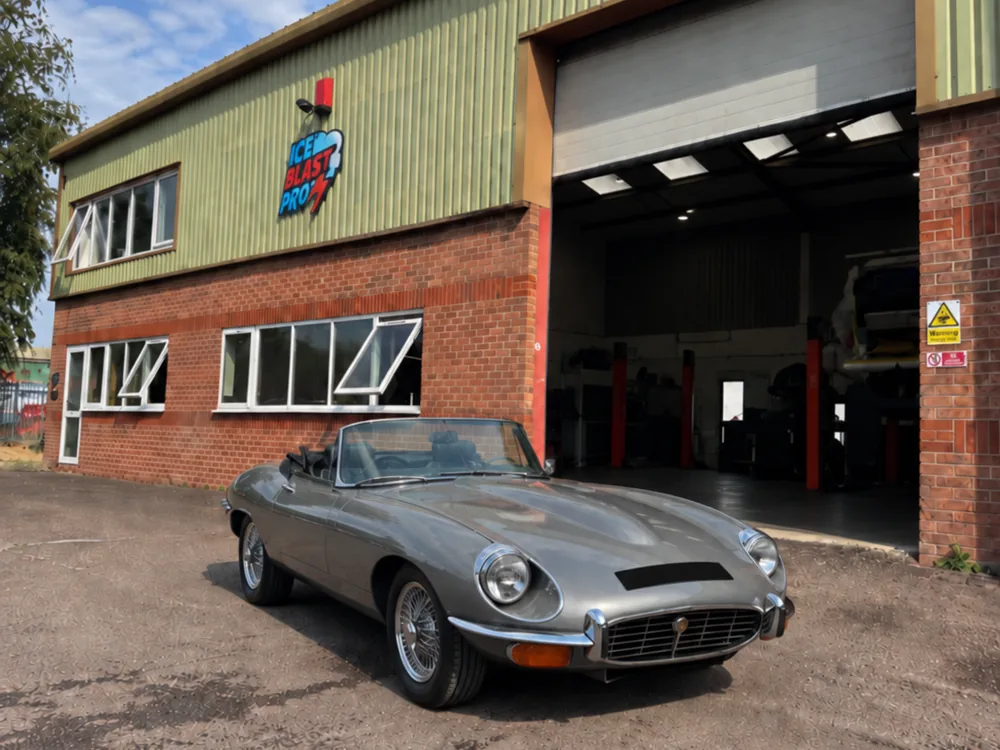 Silver Jaguar E-Type roadster outside the IceBlastPro workshop in Oxfordshire