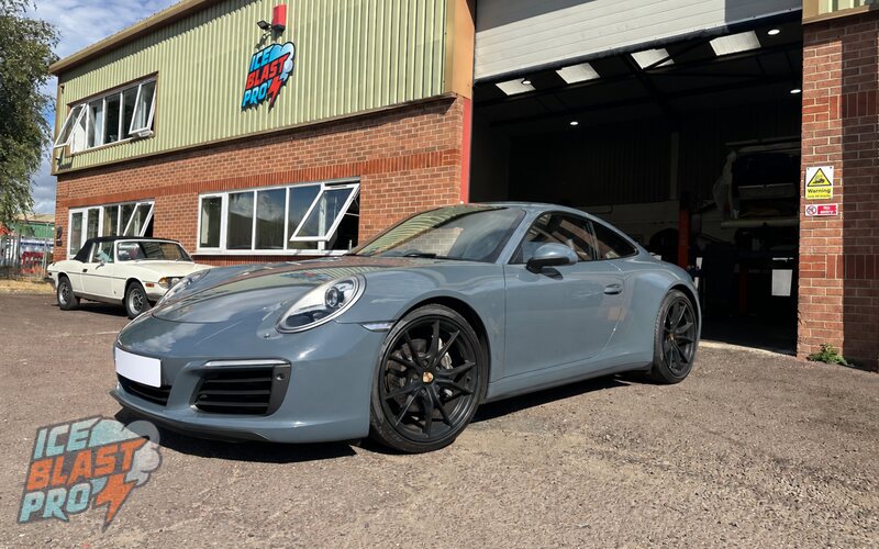 Grey Porsche 911 Carrera 4 outside the IceBlastPro workshop