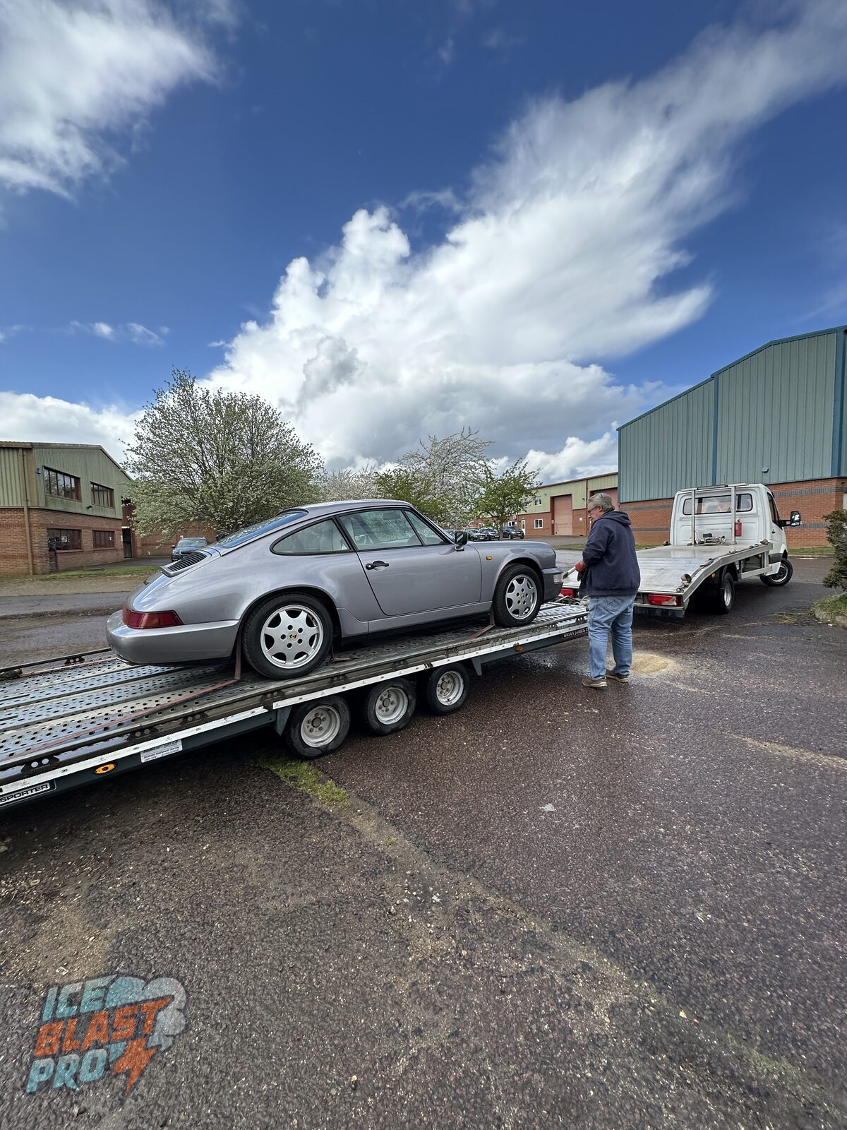 Silver Porsche 911 Carrera 4 (964) arriving at the IceBlastPro workshop for a full underbody preservation programme