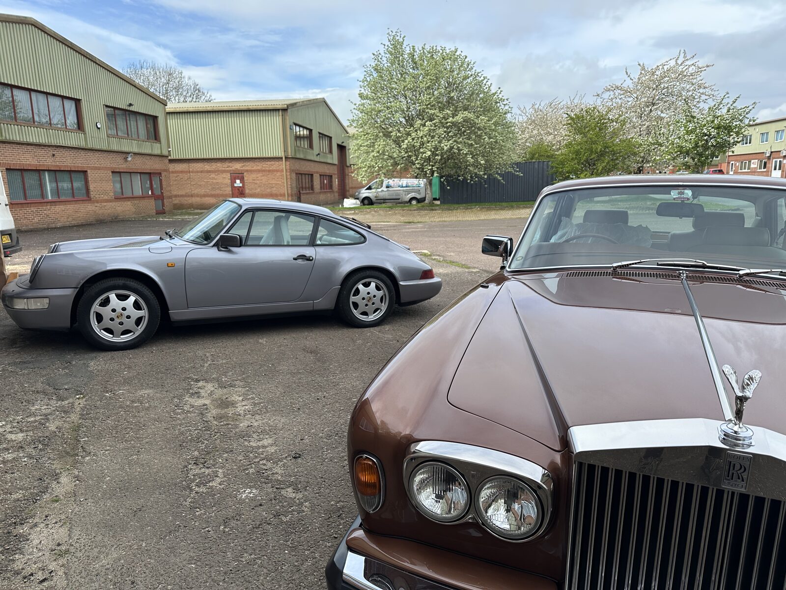 Back on its wheels – The finished Carrera 4 outside the workshop, alongside another classic booked in for preservation.