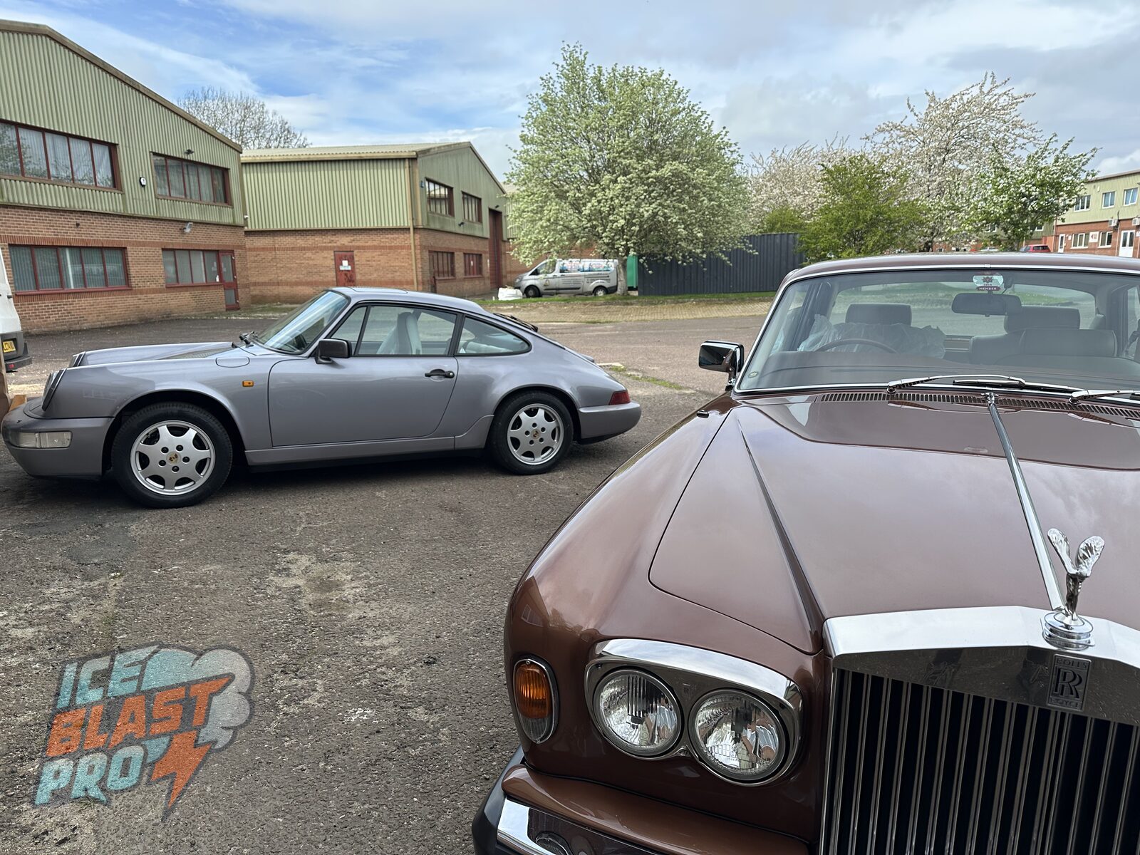 Back on its wheels – The finished Carrera 4 outside the workshop, alongside another classic booked in for preservation.