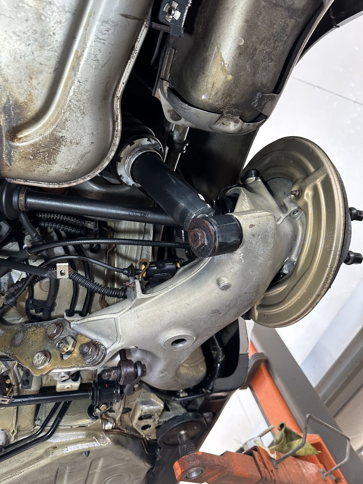 The same Porsche 911 Carrera 4 rear lower arm after dry ice cleaning – the alloy arm cleaned back to a sharp silver finish