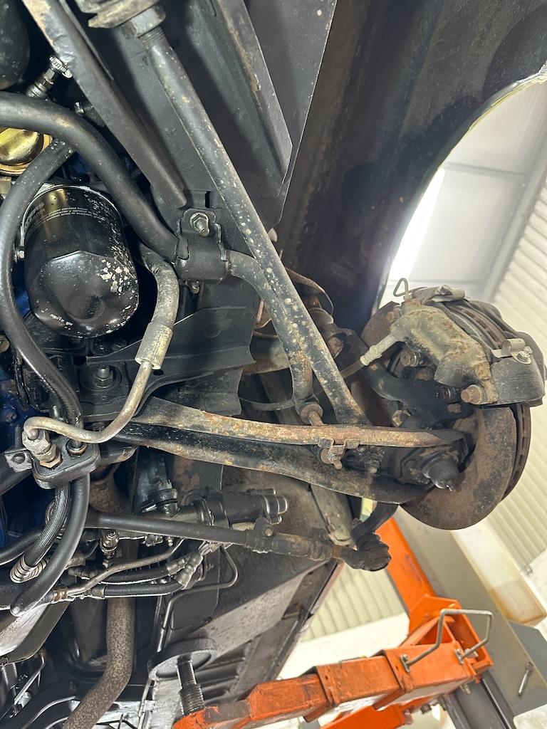 Front suspension – The first area road debris and moisture hit. Already showing on the lip of the arms where matter holds and sits.