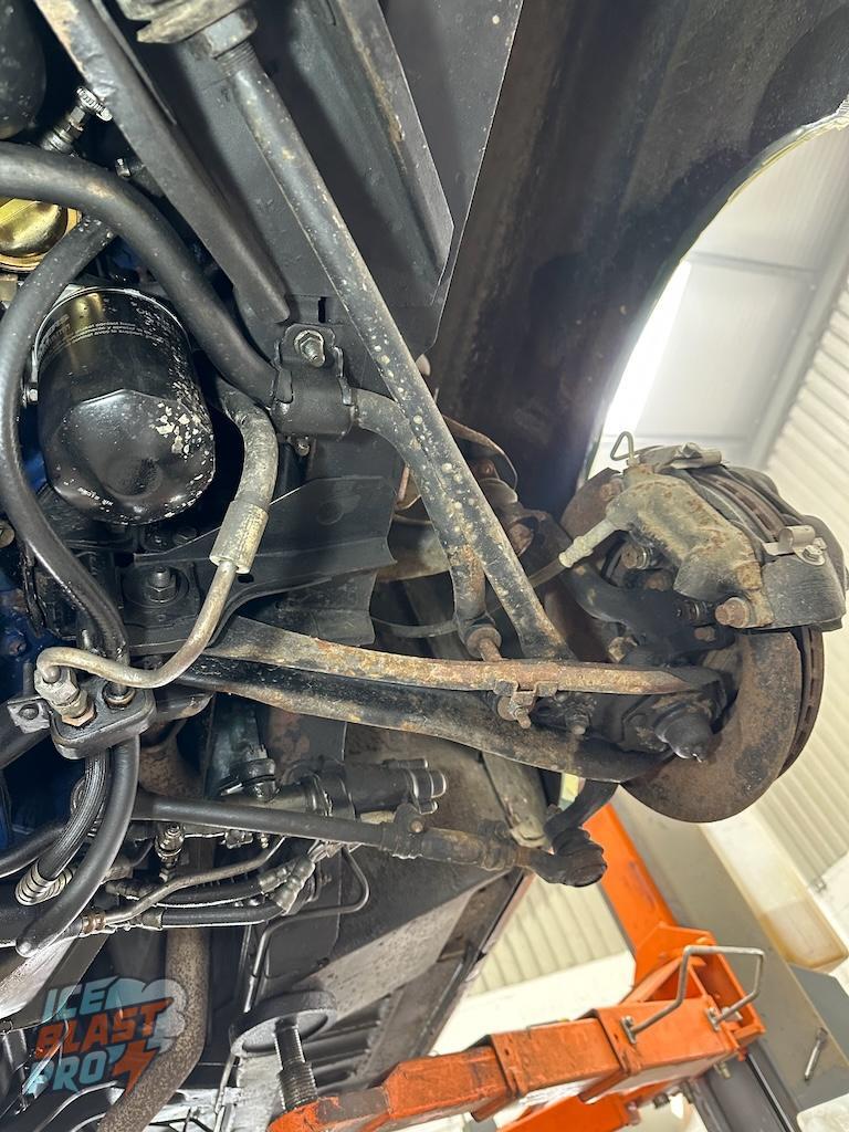 Front suspension – The first area road debris and moisture hit. Already showing on the lip of the arms where matter holds and sits.
