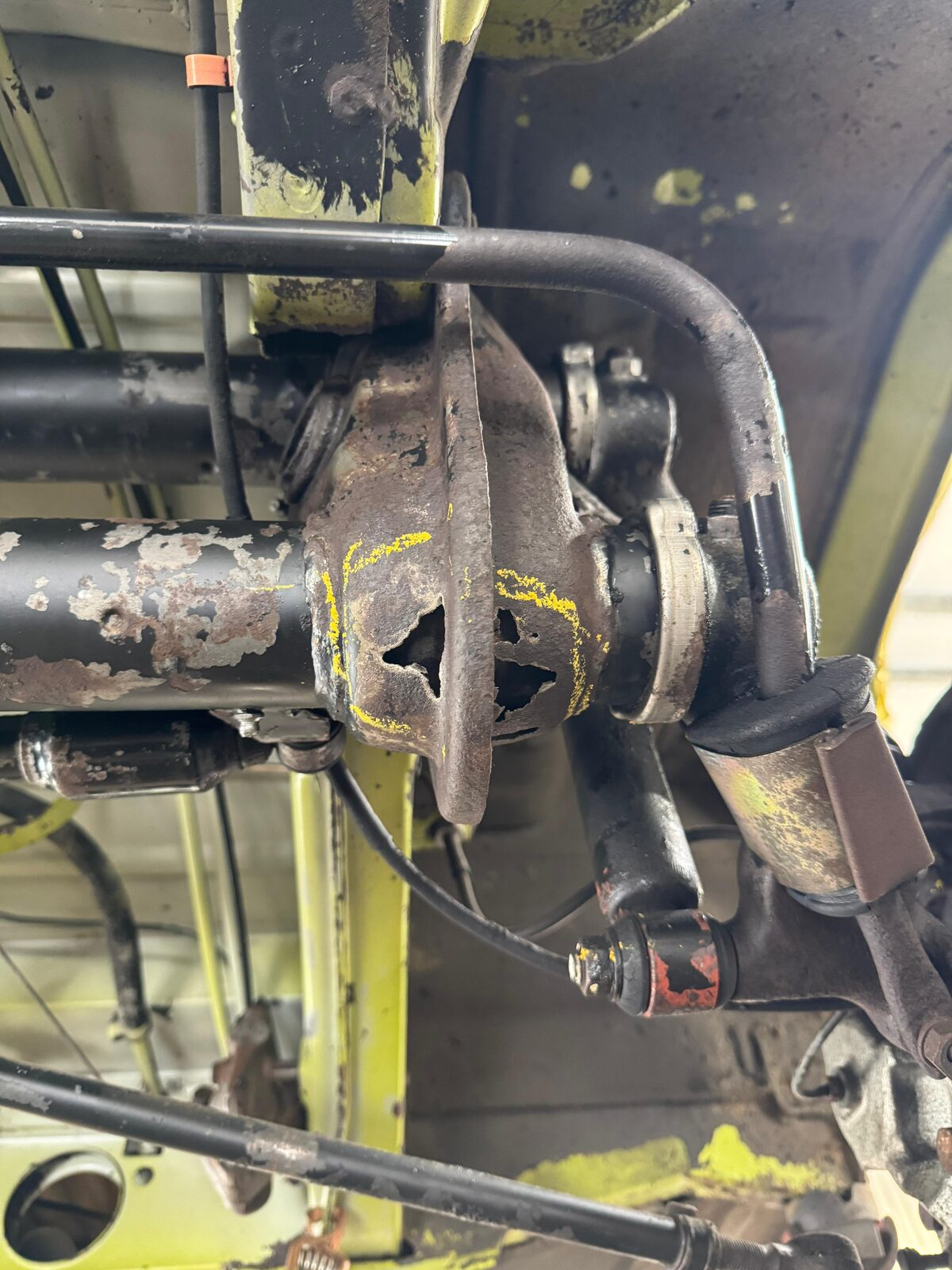 Corrosion through the beam – With the grime gone, corrosion had eaten right through the metal – marked up so it could be discussed and repaired rather than coated over.