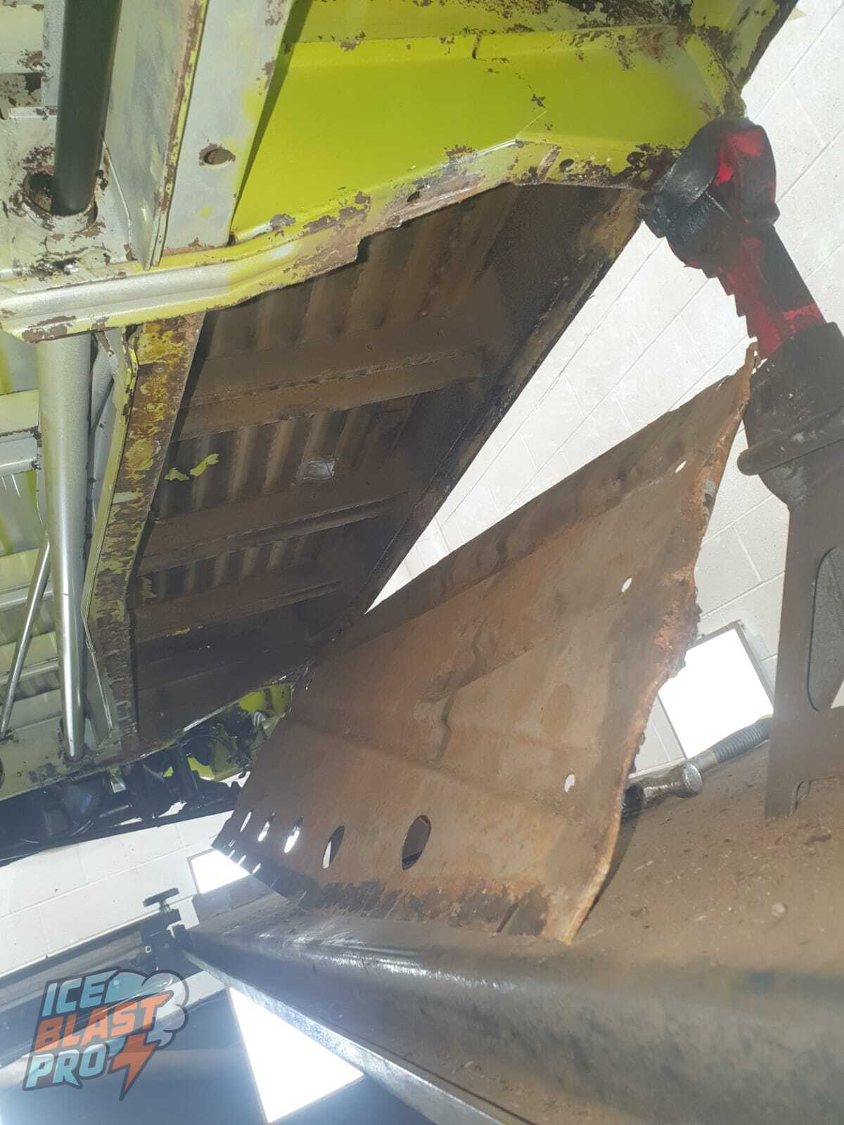 Undertray removed – A corroded, welded-on tray taken off to reach the metal behind it – the kind of trapped area where moisture sits unseen and rust takes hold.