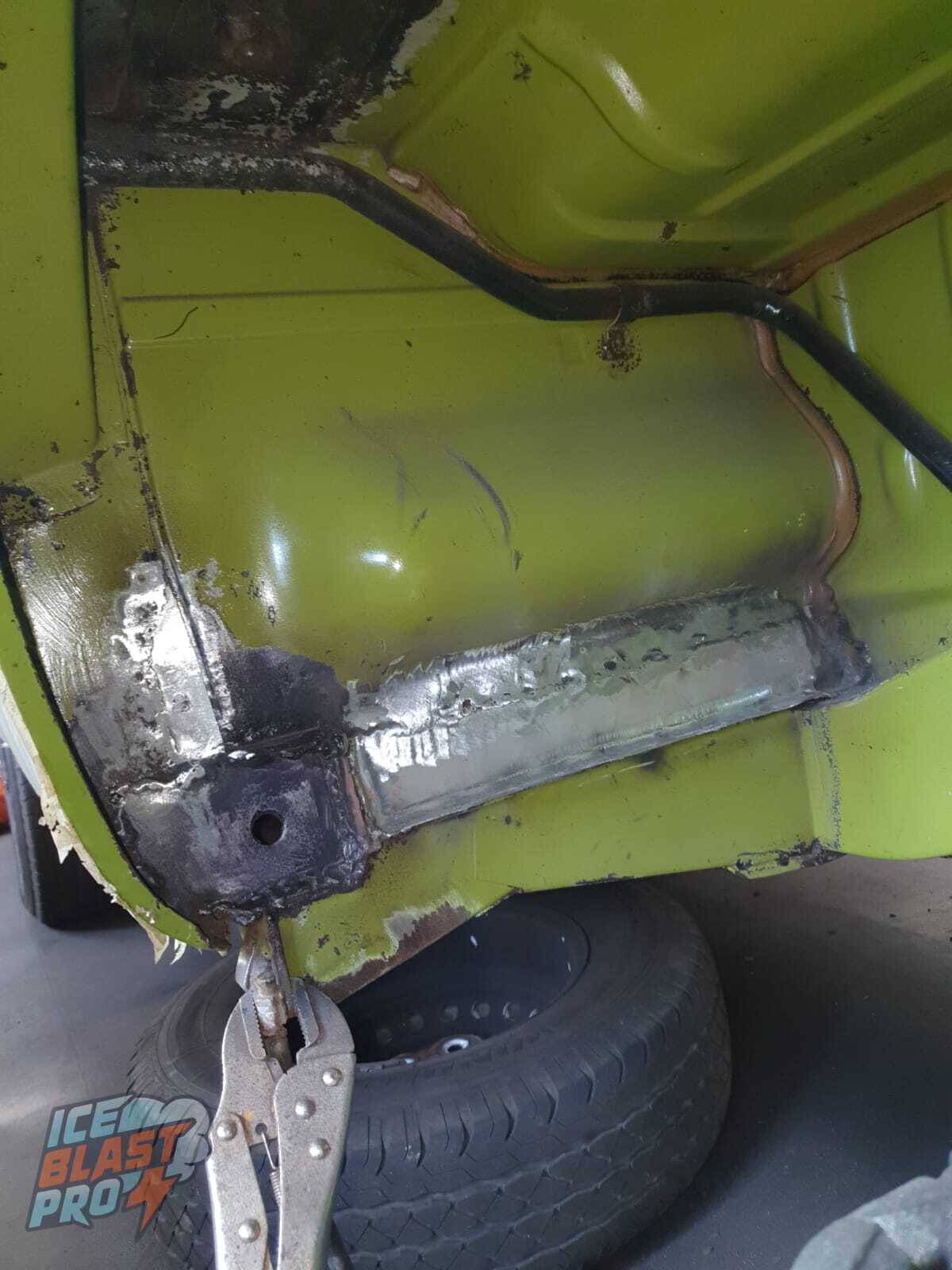 Welding in fresh metal – The corroded section cut back to sound steel and new metal welded in – a proper structural repair in place of the failed fibreglass.